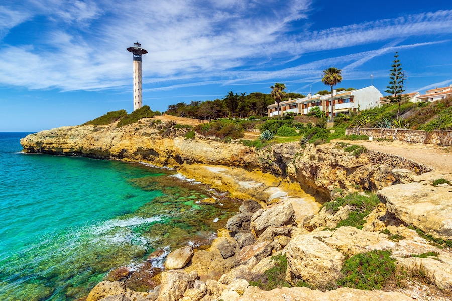 Lighthouse and cliffs in Torredembarra, Costa Dorada, Catalonia, Spain.