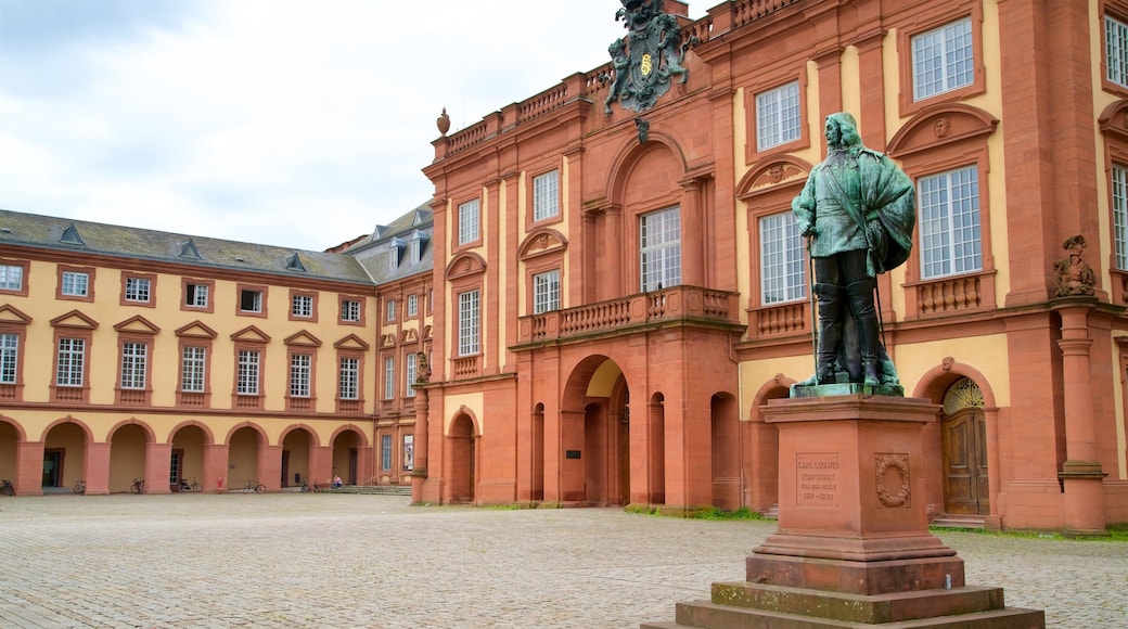 Mannheim Palace which includes a square or plaza, heritage elements and a statue or sculpture