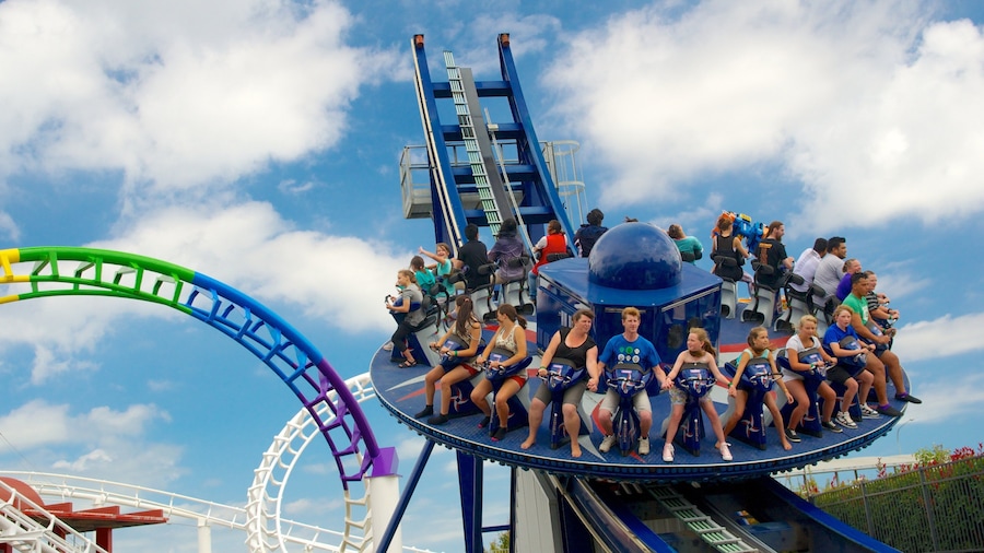 Rainbow\'s End showing rides as well as a large group of people