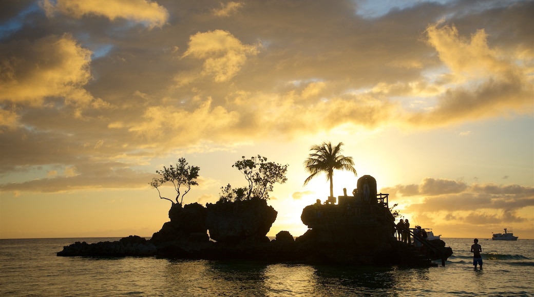Willy\'s Rock featuring island images, tropical scenes and a sunset