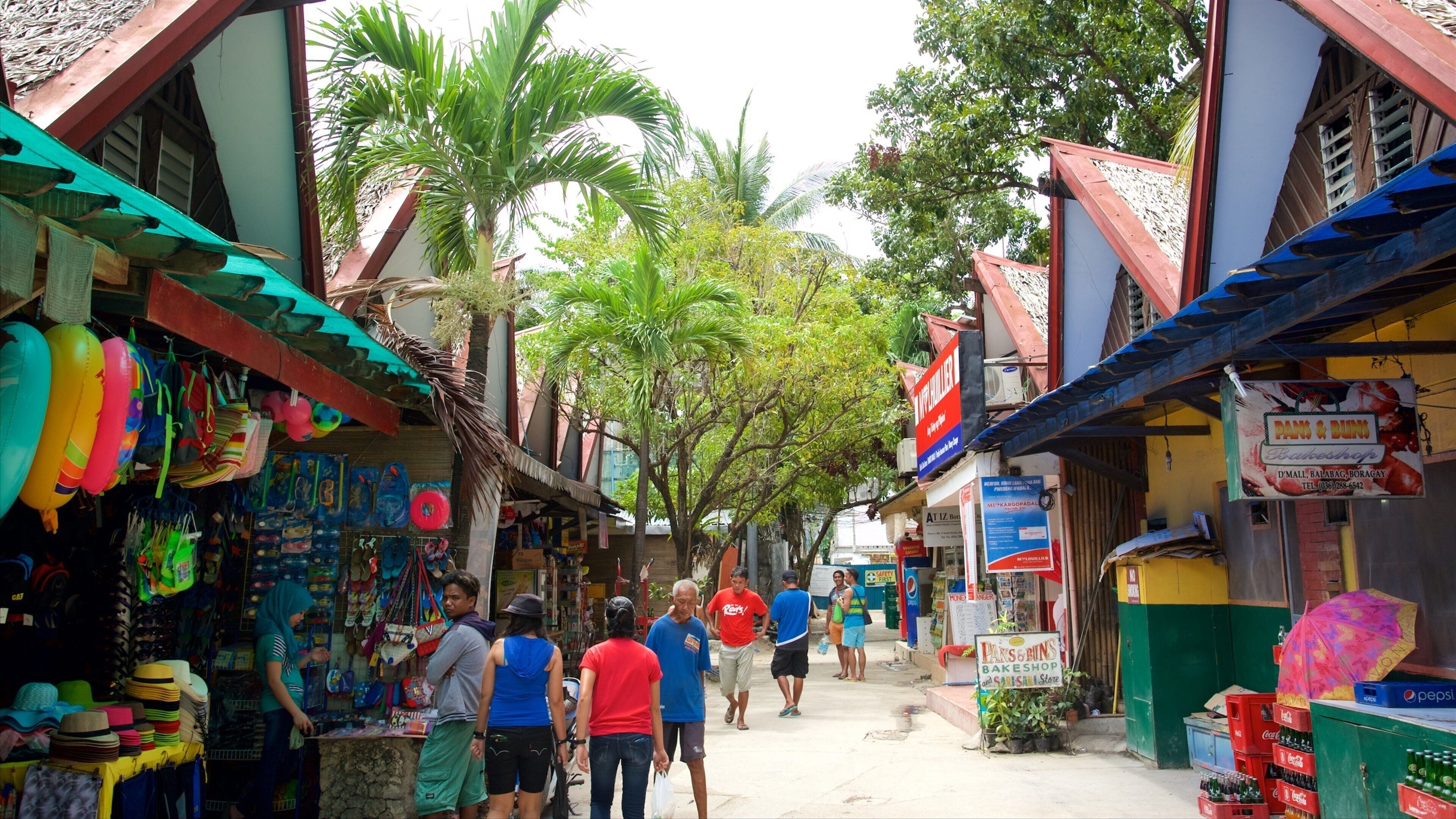 Talipapa Market som omfatter tropiske områder og markeder såvel som en lille gruppe mennesker