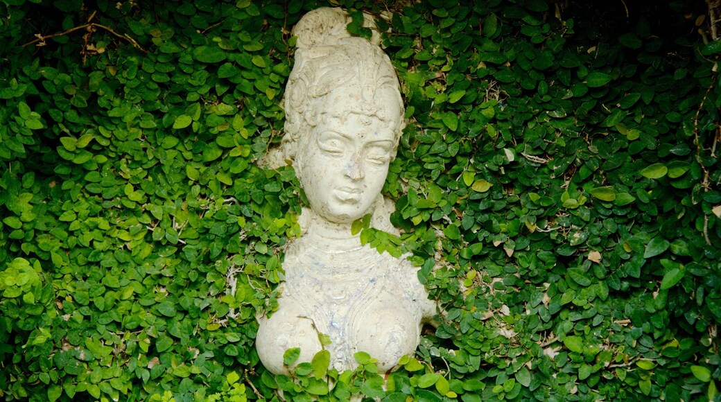 Saras Baug featuring a garden, a statue or sculpture and outdoor art