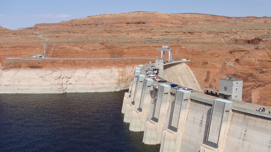 Glen Canyon Dam is a concrete arch dam on the Colorado River in northern Arizona in the United States, near the town of Page. The dam was built to provide hydroelectricity and flow regulation from the upper Colorado River Basin to the lower. Its reservoir is called Lake Powell, and is the second-largest artificial lake in the country, extending upriver well into Utah. The dam is named for Glen Canyon, a colorful series of gorges, most of which now lies under the reservoir.
#LikeALocal