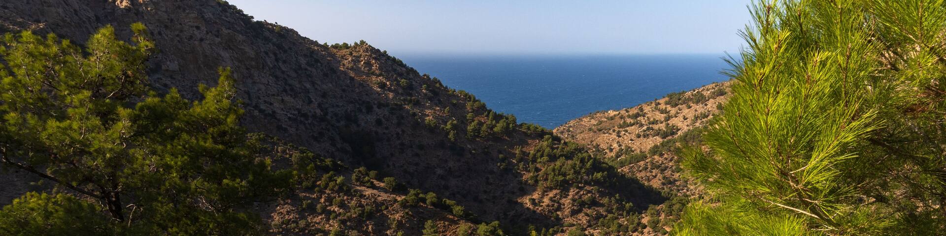 Halari gorge with wooded mountains, canyon and fantastic view to the Nas bay and Aegean sea