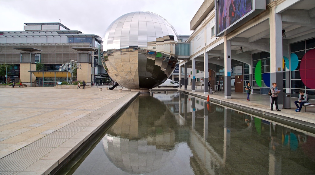 Millennium Square showing a pond and outdoor art