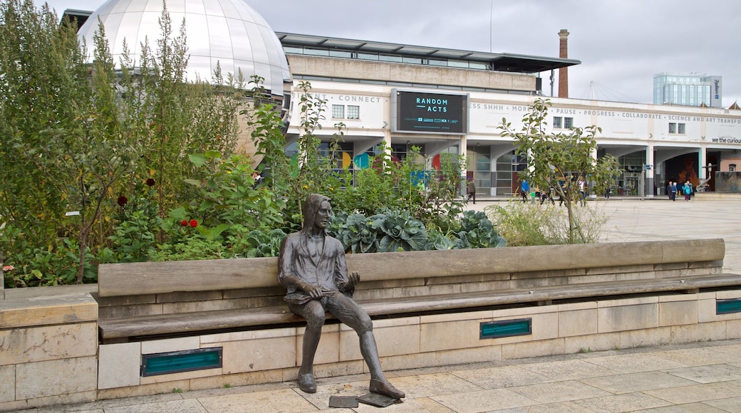 Millennium Square showing a statue or sculpture and outdoor art