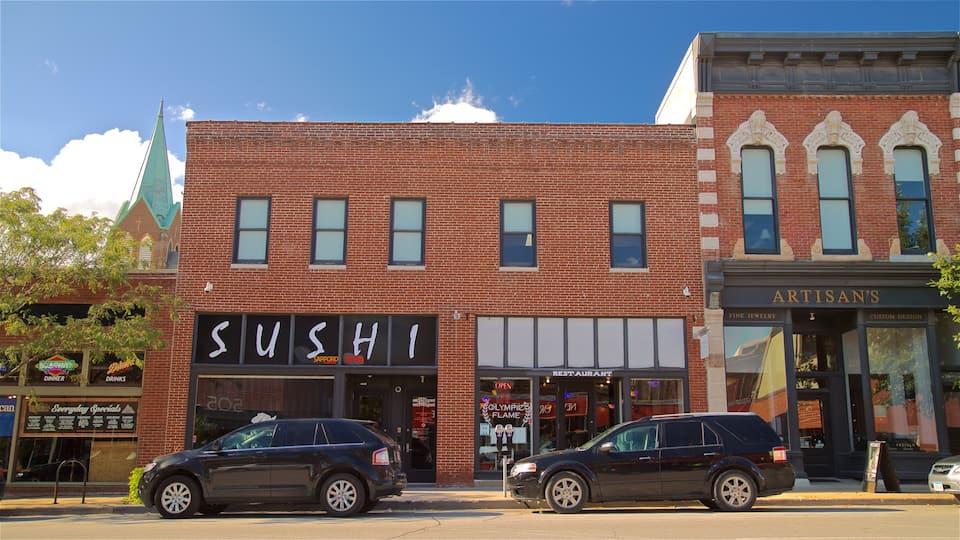 A brick building with a sushi restaurant and an artisan's shop.