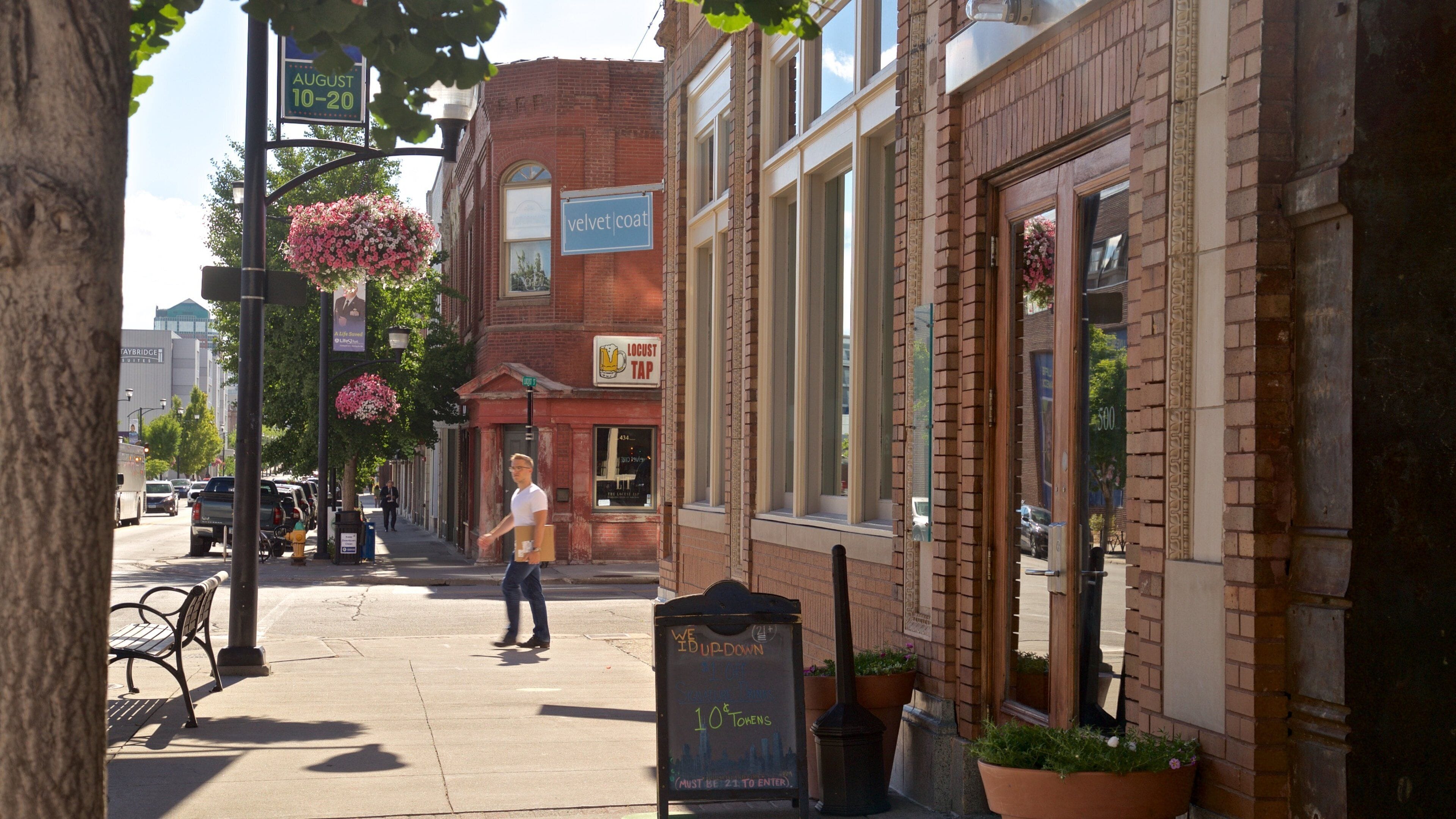 Historic East Village which includes flowers and street scenes as well as an individual male