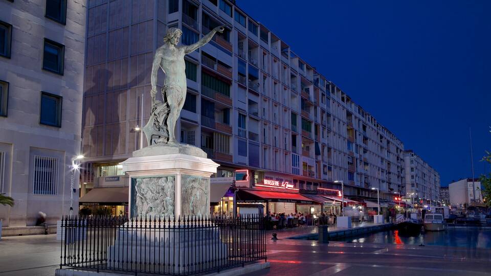 Toulon Marina featuring night scenes, a square or plaza and a statue or sculpture