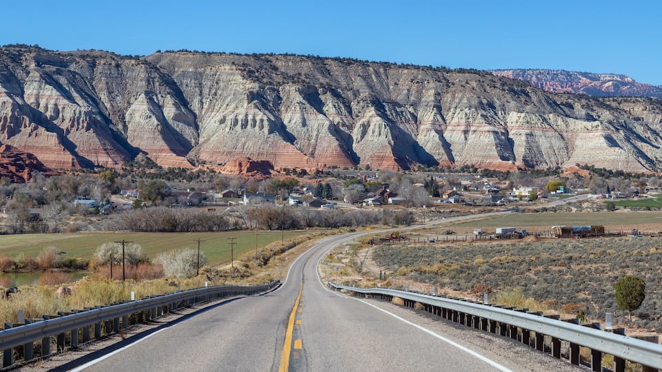 Scenic road in the desert during a vibrant sunny day. Taken on Route 12 near Cannonville, Utah, United States of America.