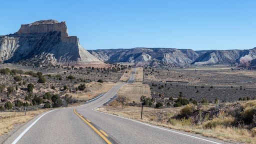 Scenic road in the desert during a vibrant sunny day. Taken on Route 12 near Cannonville, Utah, United States of America.