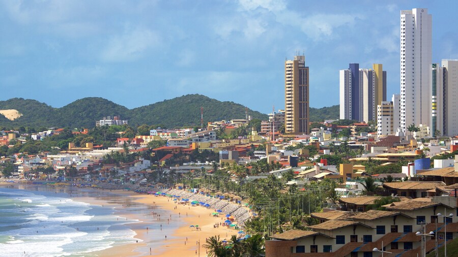 Ponta Negra Beach showing a high rise building, a coastal town and a beach