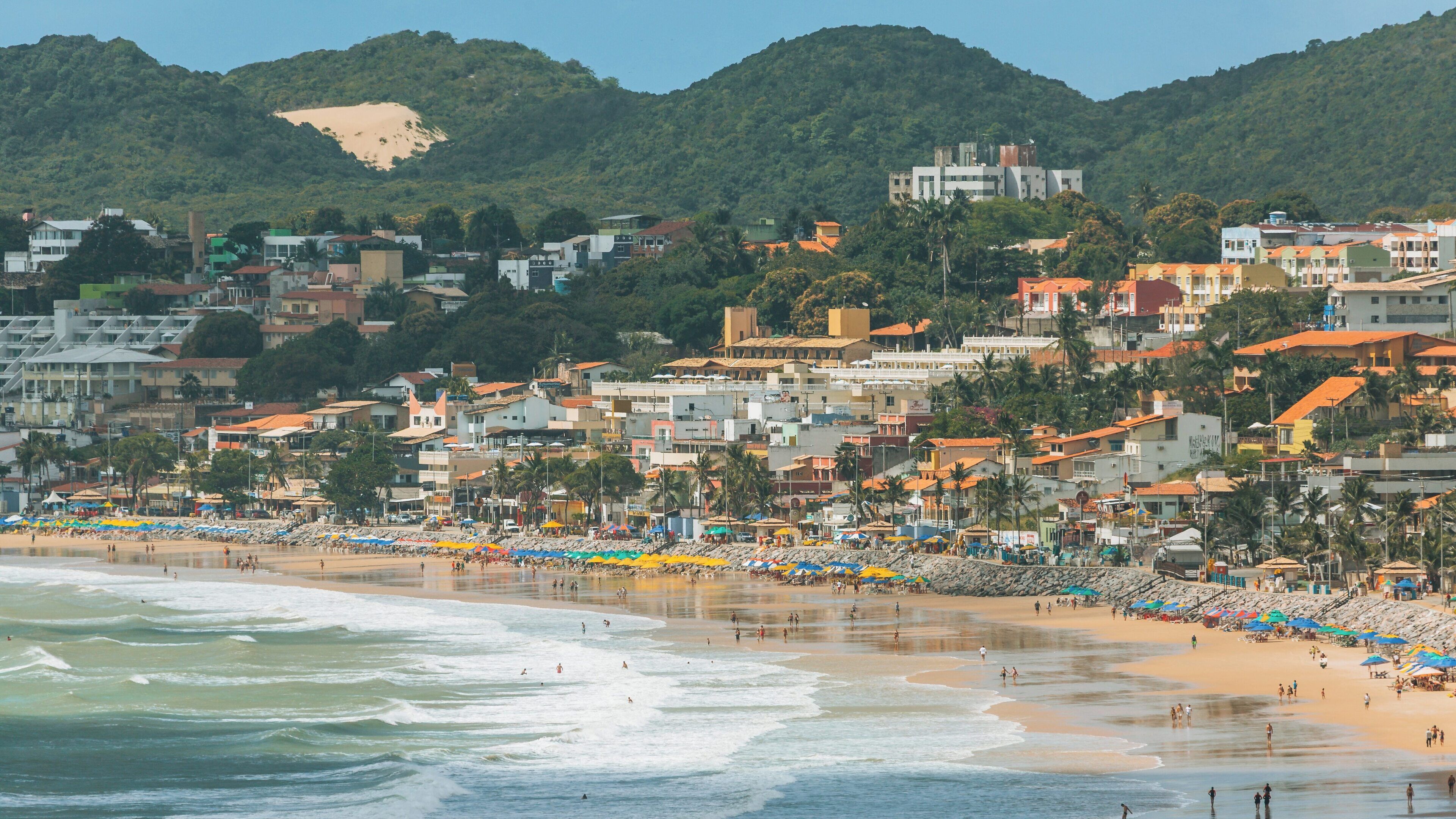Ponta Negra Beach in Natal, Brazil, inviting visitors to enjoy sandy shores and vibrant local culture