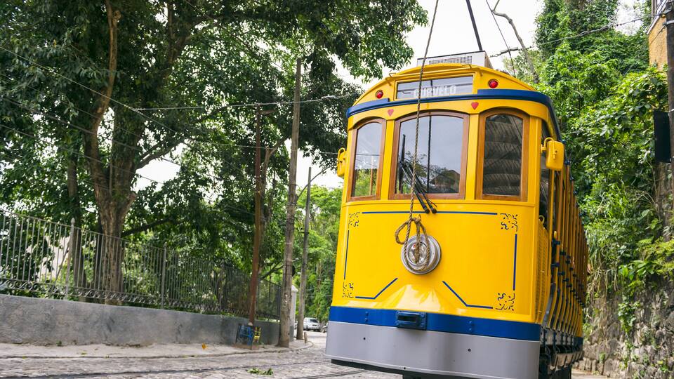 Old-fashioned bonde tram travels near Largo dos Guimar√£es, the heart of the hillside neighborhood of Santa Teresa in Rio de Janeiro, Brazil ; Shutterstock ID 468093539