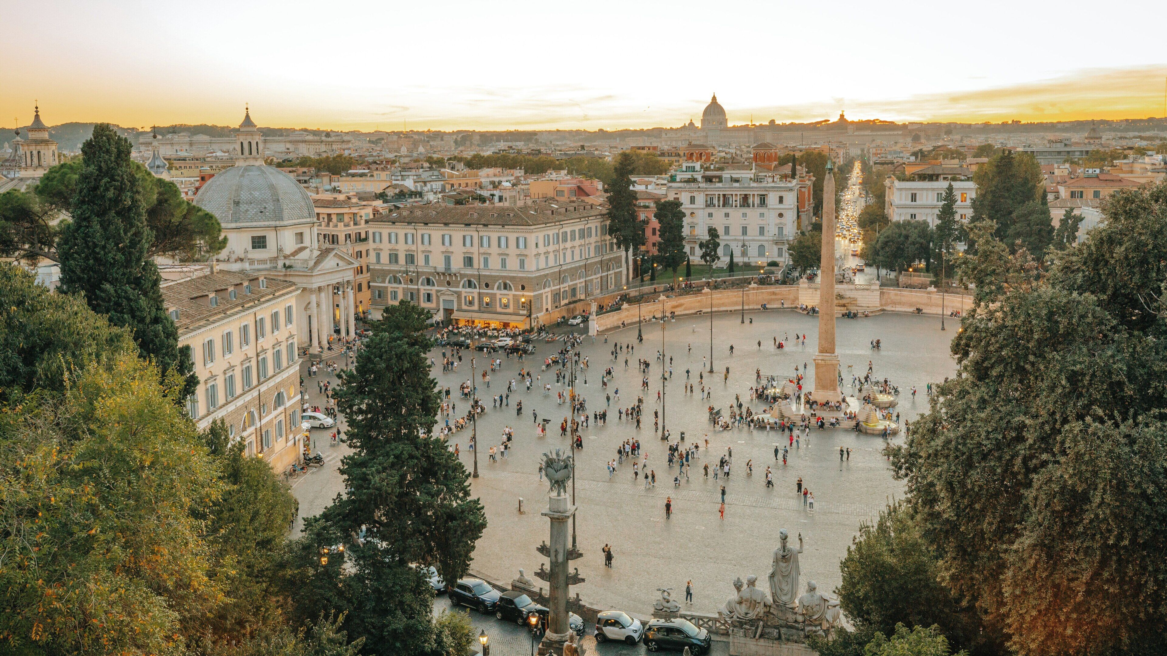 Pincio Terrace offers stunning views of Rome's Historic Centre at sunset, showcasing vibrant life and beautiful architecture in Lazio, Italy