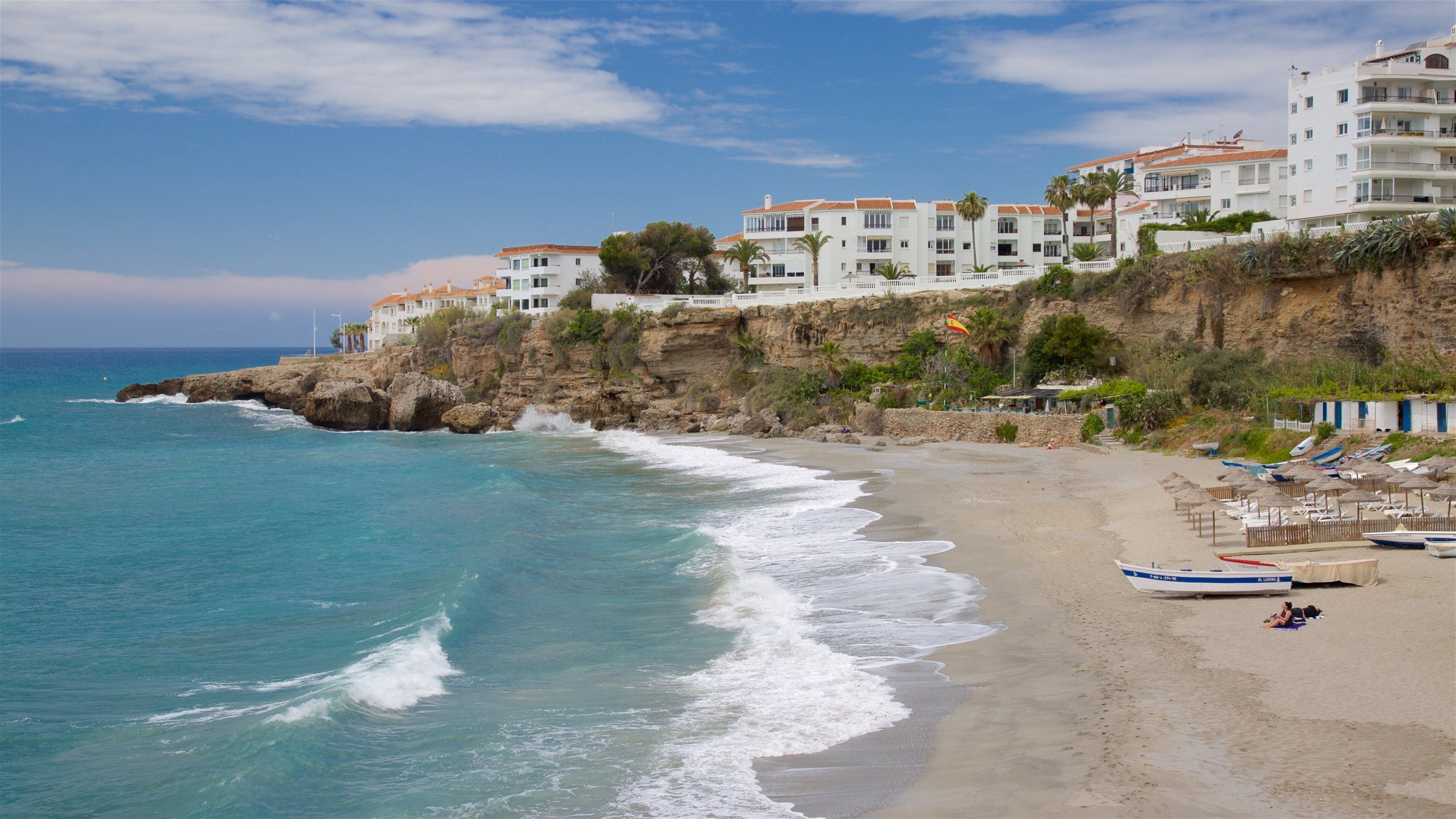 Salon Beach showing a sandy beach, a bay or harbour and a coastal town