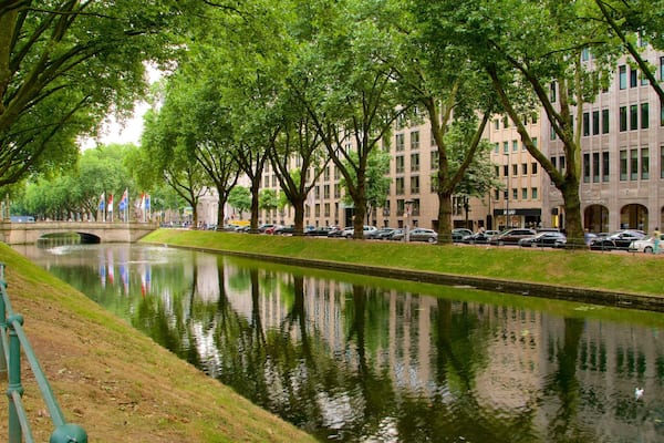 Konigsallee featuring a river or creek and a garden