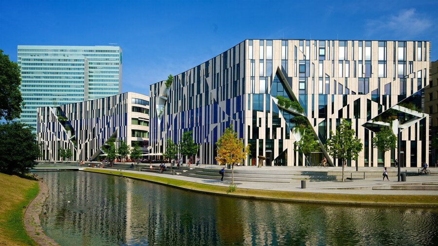 Konigsallee which includes a city, a river or creek and modern architecture