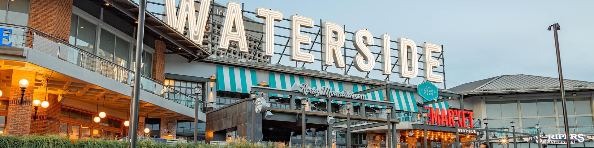 Waterside Festival Marketplace which includes signage as well as a family