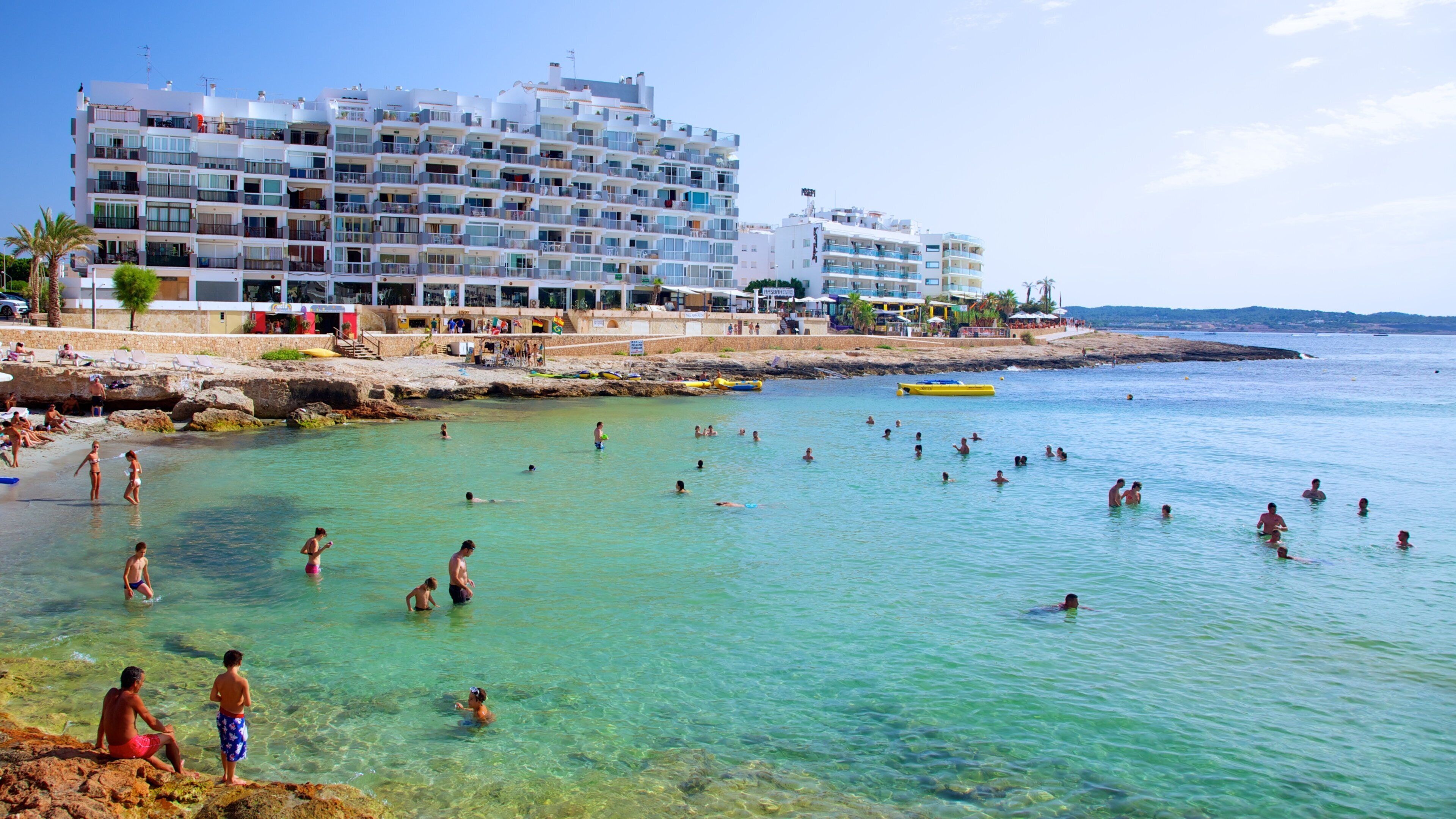 Calo des Moro Beach which includes general coastal views, a coastal town and swimming