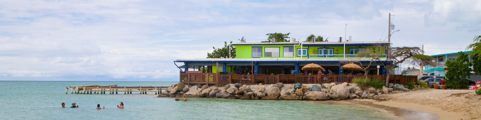 Combate Beach featuring swimming, a sandy beach and general coastal views
