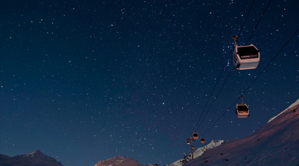 Meribel showing a gondola and night scenes