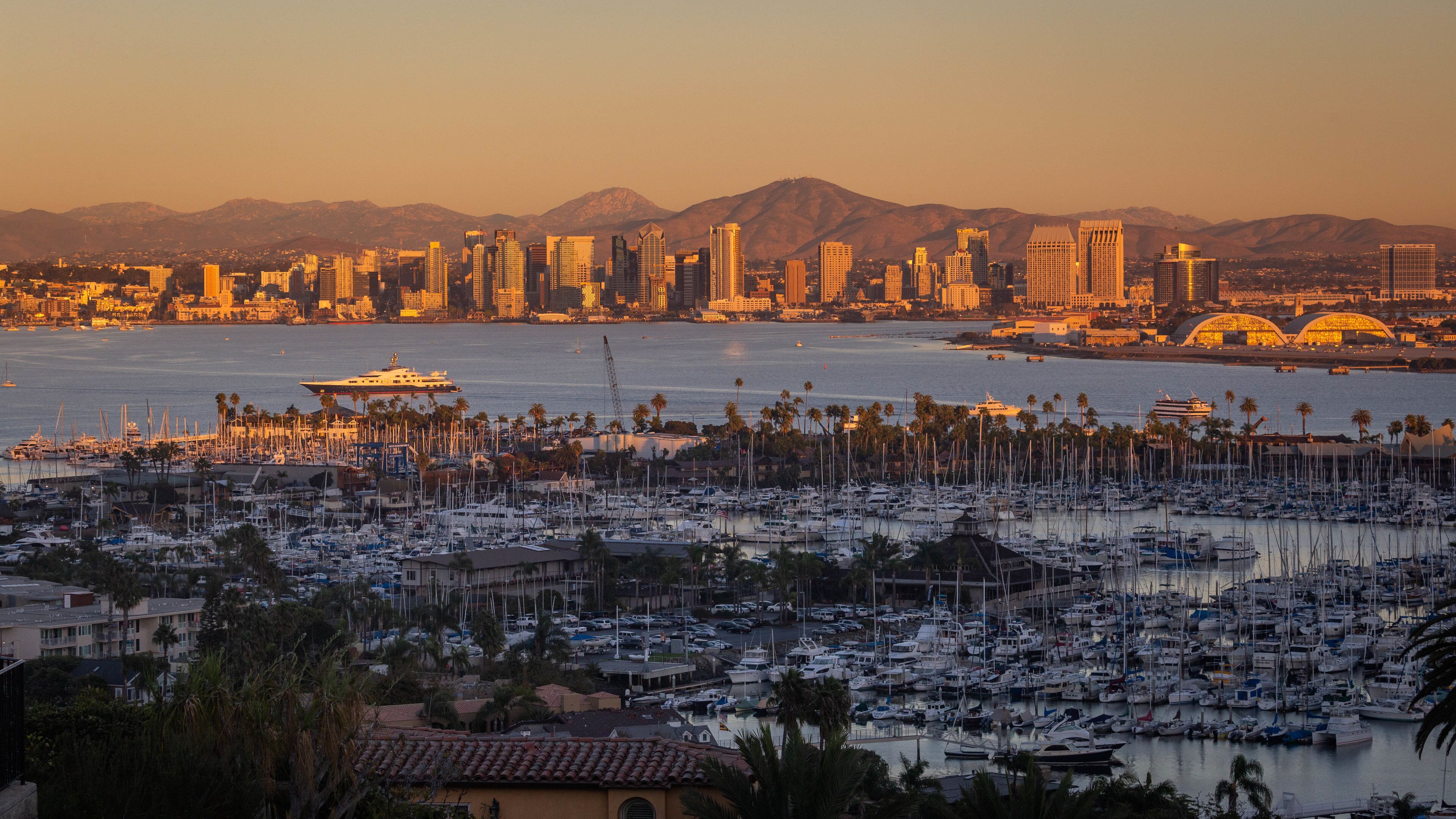Point Loma which includes a bay or harbor, a sunset and landscape views