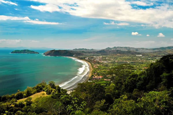 Aerial of Jaco Costa Rica, beach, The pacific coast.Rainforest sits in the forground