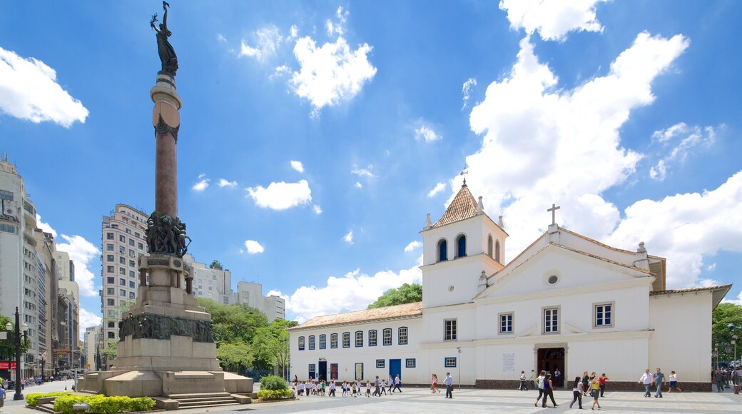 College Courtyard which includes a monument, a church or cathedral and religious elements