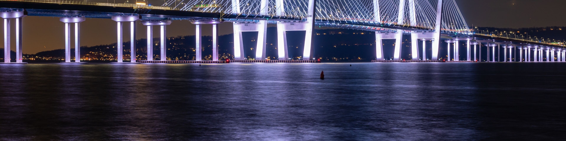 Night photo of the Governor Mario M. Cuomo Bridge, spanning the Hudson River between Tarrytown and Nyack