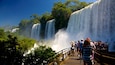 Iguacu Falls which includes a waterfall as well as a large group of people