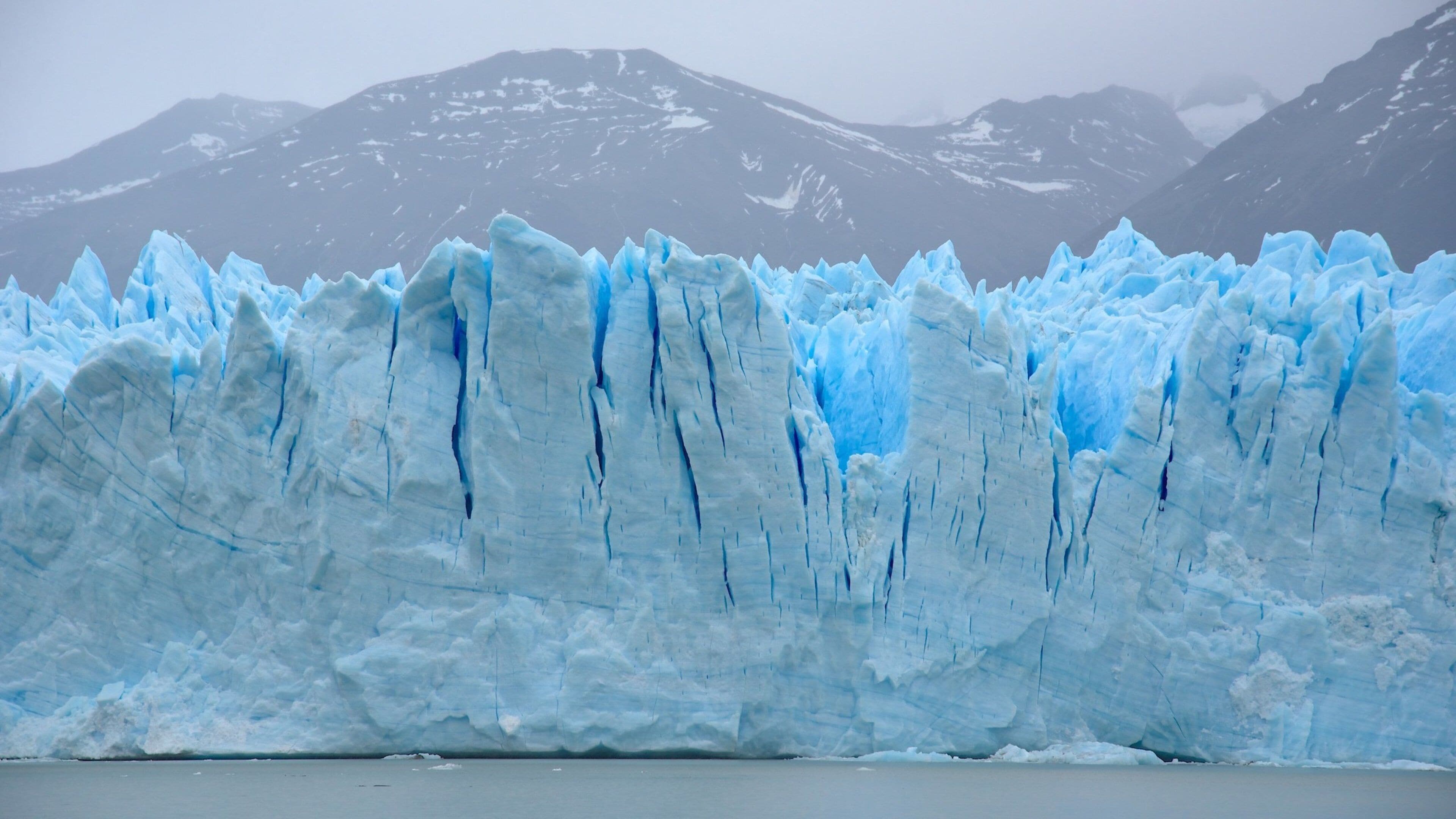 Perito Moreno Glacier which includes a lake or waterhole and general coastal views
