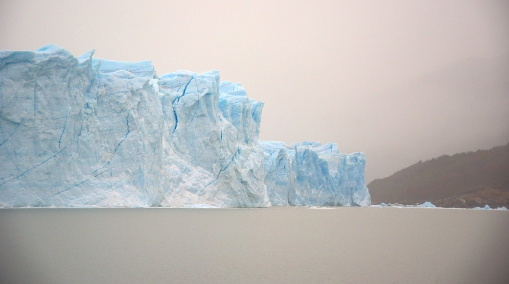 Perito Moreno Glacier which includes a lake or waterhole, mist or fog and general coastal views