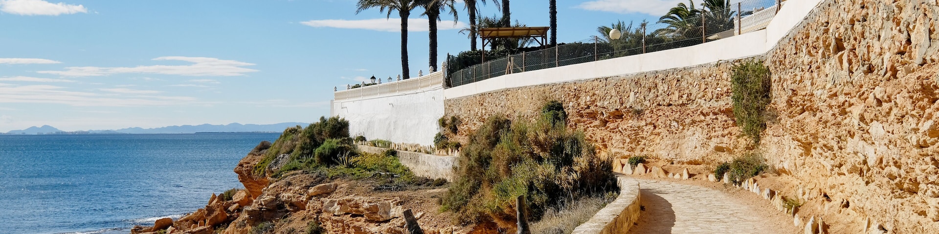 Paved promenade of Cabo Roig. Costa Blanca. Spain ; Shutterstock ID 1012340419; purchase_order: SP-1332 HA Batch 2 August 2018; Order: ; client: HomeAway; other: To be paid with HA budget