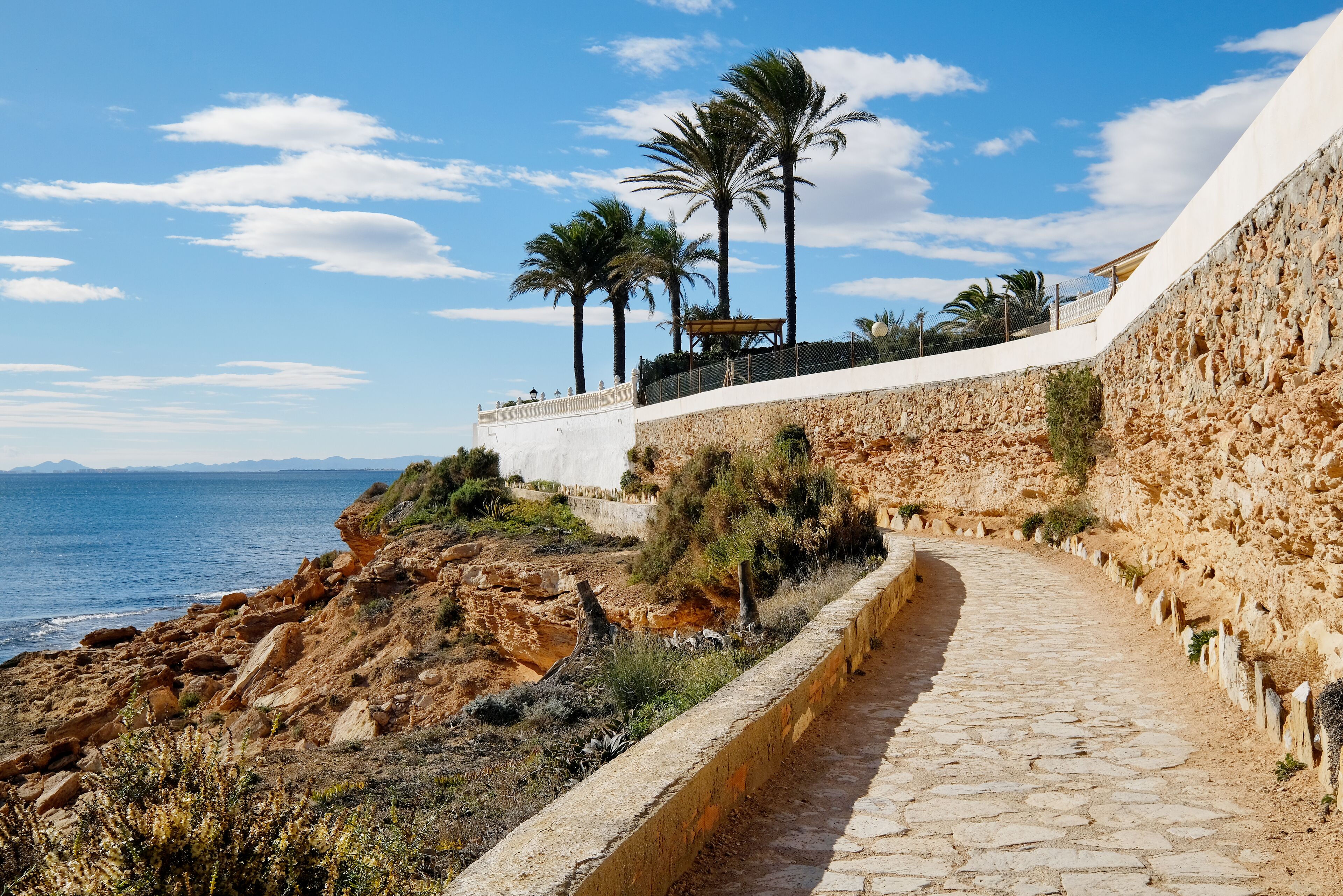 Paved promenade of Cabo Roig. Costa Blanca. Spain ; Shutterstock ID 1012340419; purchase_order: SP-1332 HA Batch 2 August 2018; Order: ; client: HomeAway; other: To be paid with HA budget
