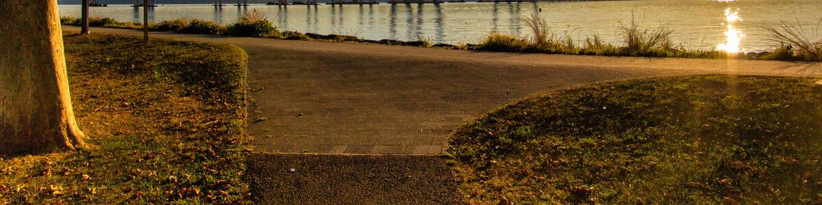 Tarrytown, NY / United States - Sept. 19, 2019: a landscape image of Pierson Park at sunset over the Hudson River.
