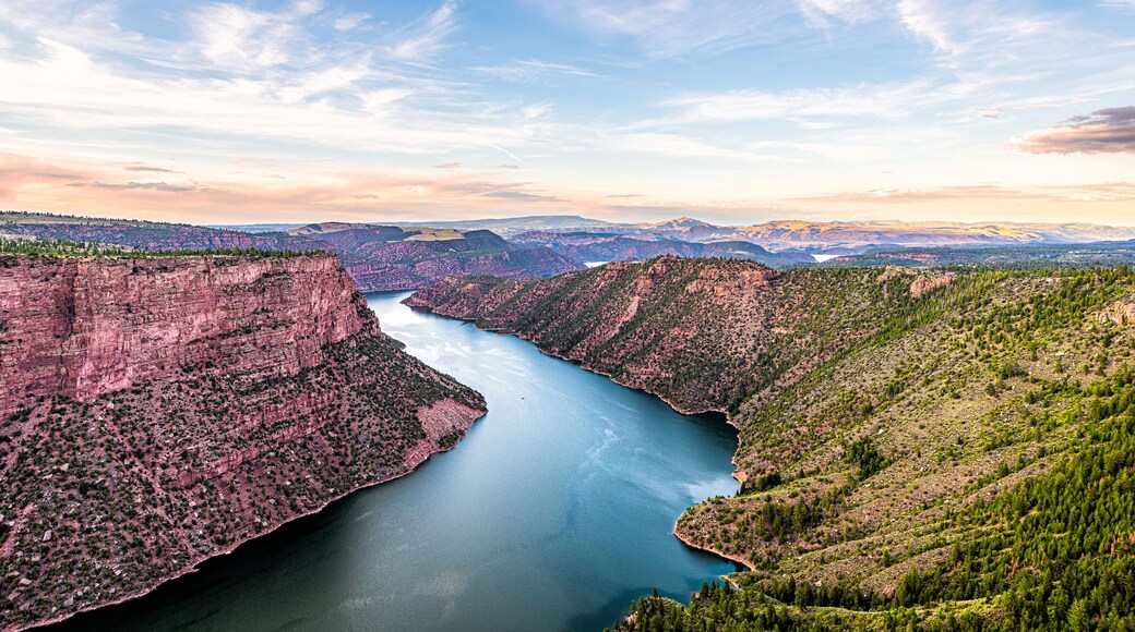 Aerial above view from Canyon Rim trail overlook near campground in Flaming Gorge Utah National Park with Green River at sunset