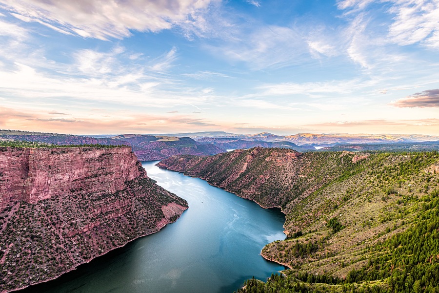 Aerial above view from Canyon Rim trail overlook near campground in Flaming Gorge Utah National Park with Green River at sunset