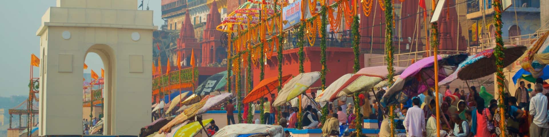 Dasaswamedh ghat featuring markets as well as a large group of people