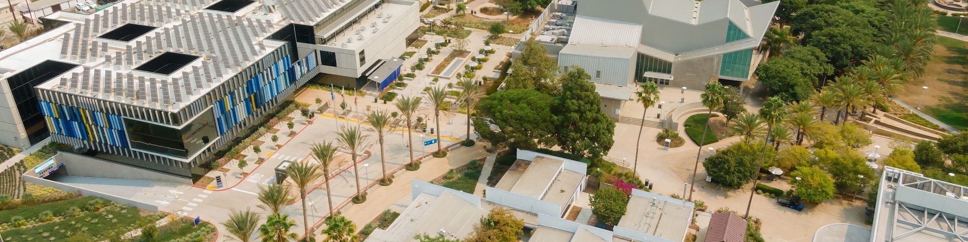 Aerial view of Santa Monica College in California, USA. The photo shows the campus buildings, palm trees, and surrounding neighborhood. The image highlights the college's architecture.