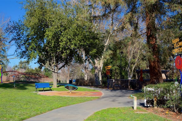 Happy Hollow Park and Zoo featuring a garden and signage