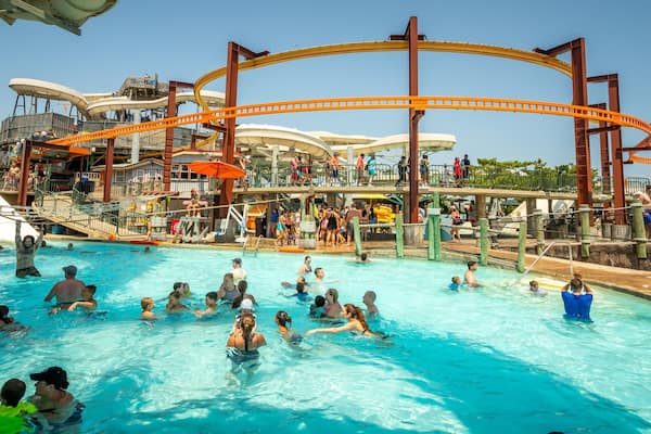 Raging Waters showing a waterpark and swimming as well as a large group of people