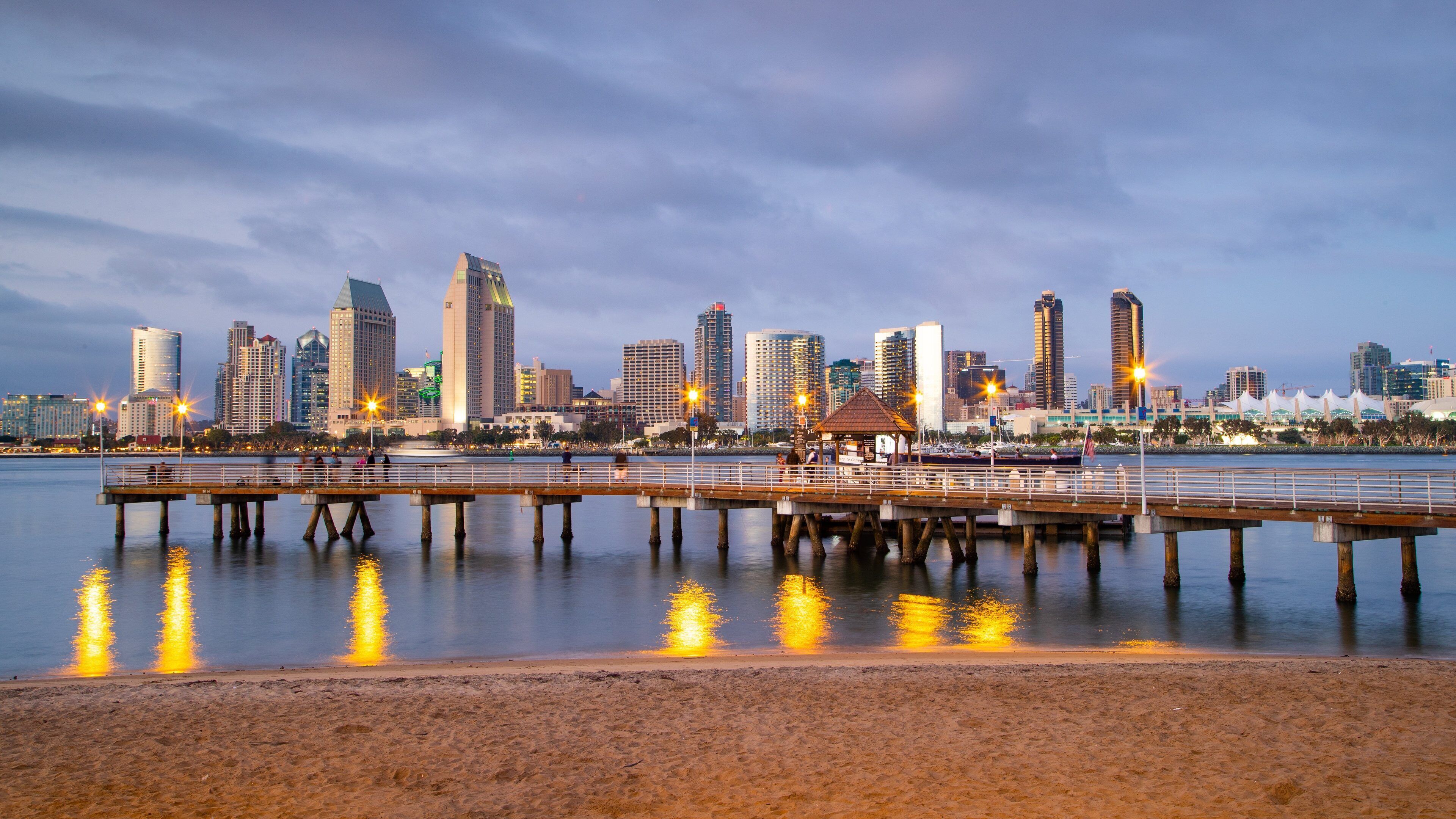 Coronado Ferry Landing featuring a sunset, a city and a beach