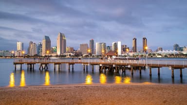 Coronado Ferry Landing featuring a sunset, a city and a beach