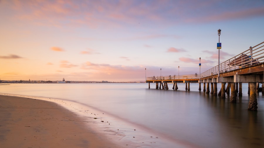 Coronado Ferry Landing featuring general coastal views, a sandy beach and a sunset