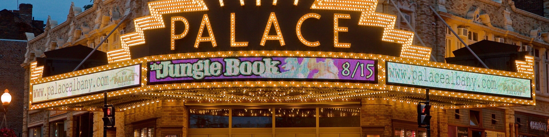 Palace Theater featuring signage and night scenes