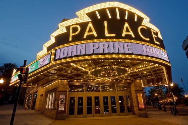 Palace Theater which includes night scenes, signage and heritage architecture