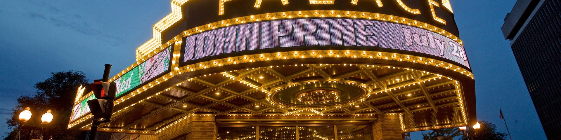 Palace Theater which includes night scenes, signage and heritage architecture
