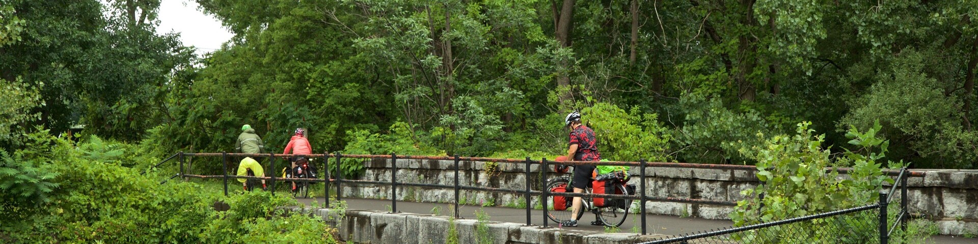 Old Erie Canal Historic State Park which includes a bridge and a park as well as a small group of people