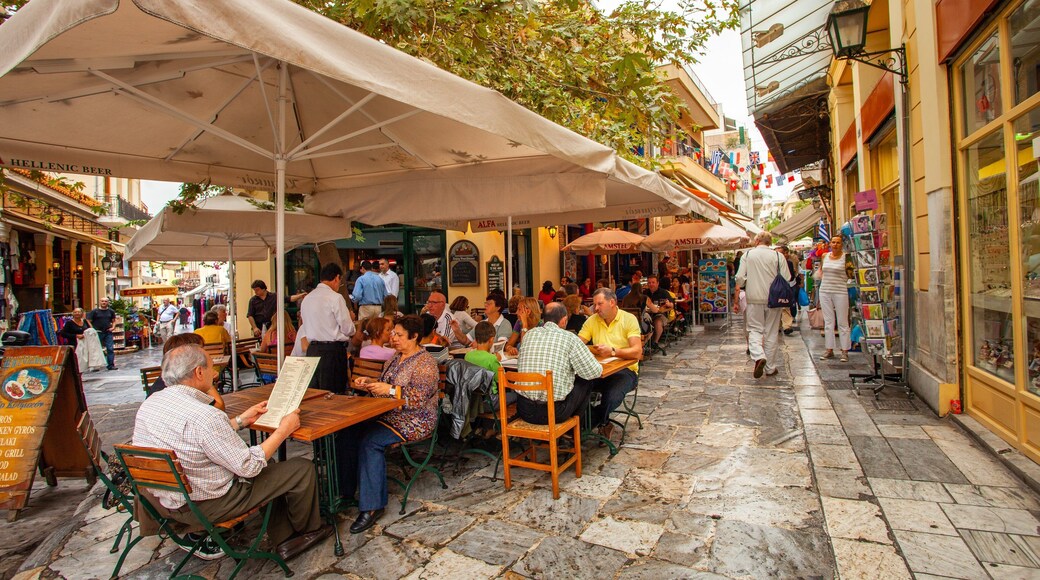 Monastiraki Flea Market which includes outdoor eating and street scenes as well as a small group of people